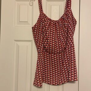 Cabi blue, orange and white top. No sleeves and a zipper. Size 14.